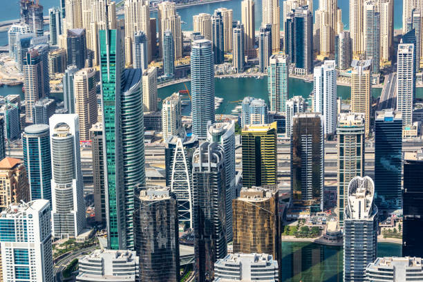 Aerial view of modern high-rise buildings in Emaar Valley Phase 2, showcasing investment opportunities for buyers.