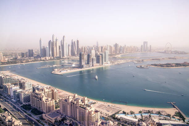 A panoramic view of luxurious residential skyscrapers and waterfront in an elite Dubai living area.